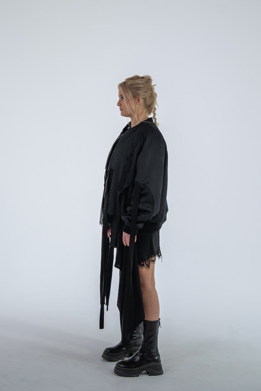 Person wearing a black outfit with a white background